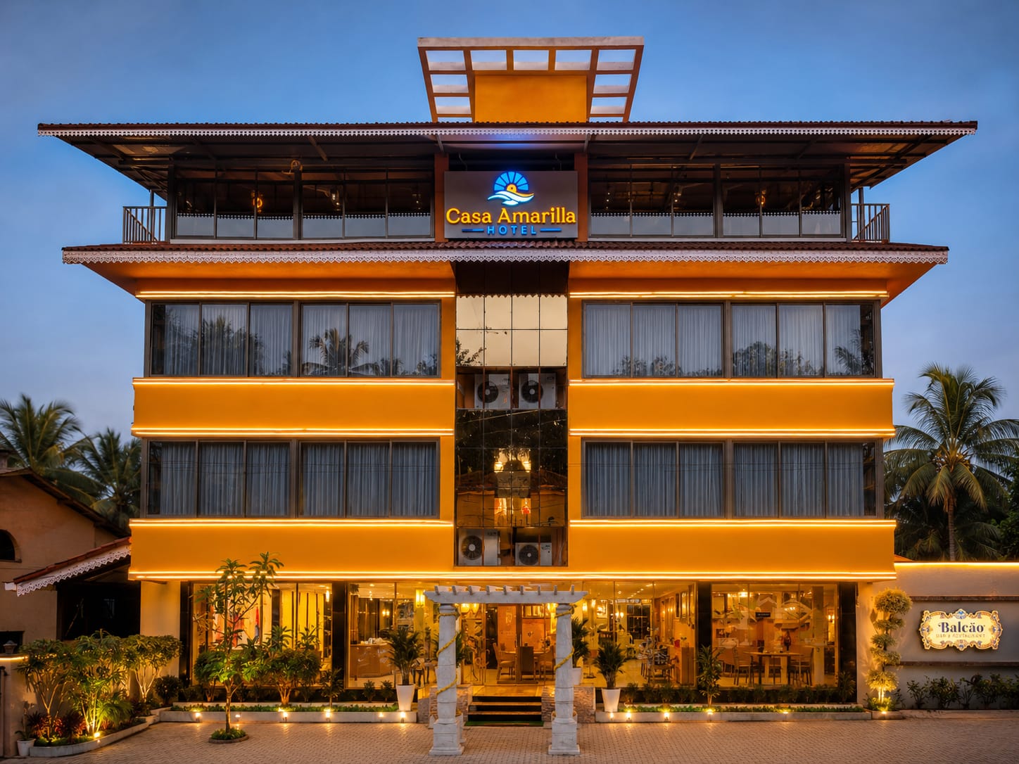 Casa Amarilla's illuminated exterior at dusk